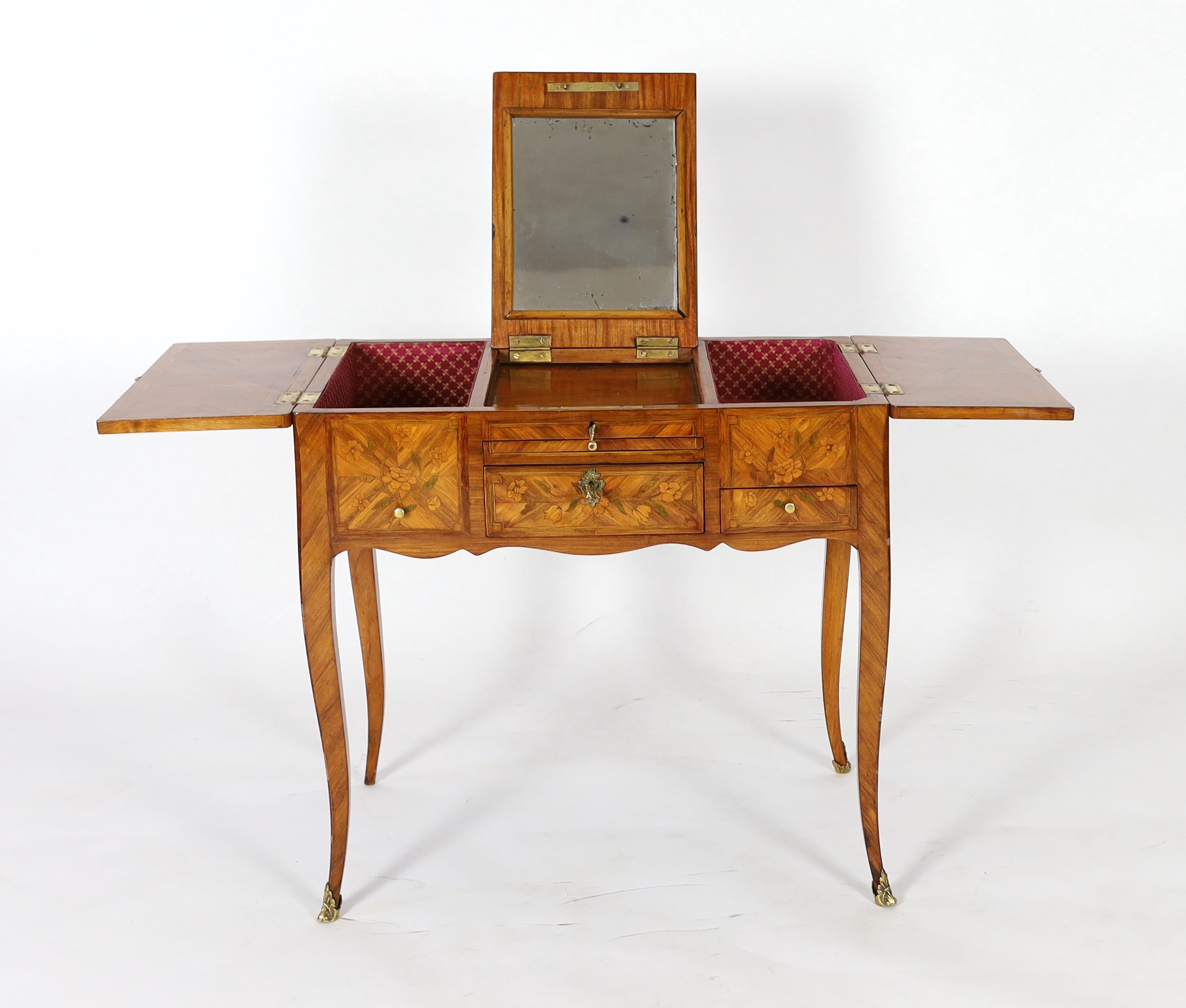 A Louis XV marquetry inlaid kingwood poudreuse, 76cm wide, 46.5cm deep, 71cm high, Please note this lot attracts an additional import tax of 5% on the hammer price